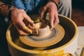 Pottery workshop. Grandpa teaches granddaughter pottery. Clay modeling