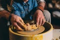 Pottery workshop. Grandpa teaches granddaughter pottery. Clay modeling