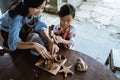 Child working with clay making pottery