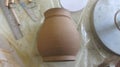 Pottery Workshop Table with Unfired Clay Pot Royalty Free Stock Photo