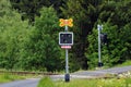 Potucky, Czech Republic - June 11, 2023: Railroad crossing in a forest with warning light and Pozor vlak sign, or Beware of train Royalty Free Stock Photo