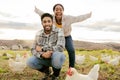 Poultry, chicken and couple farming, freedom with livestock on agriculture land, field and nature portrait. Farmer