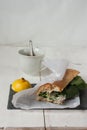 Poultry sandwich with white bread and green salad