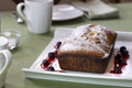 Pound Cake Loaf With Citric Sugar and Red Cherries In Syrup on a Rectangular Ceramic Plate Royalty Free Stock Photo