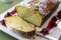 Pound Cake Loaf With Citric Sugar and Red Cherries In Syrup on a Rectangular Ceramic Plate Royalty Free Stock Photo