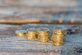 Pound Coin Stacks on Wooden Jetty, Money