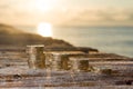 Pound Coin Stacks with sunset on Jetty Money Royalty Free Stock Photo