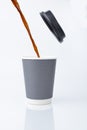 Pour the coffee water onto a paper cup with lid Royalty Free Stock Photo