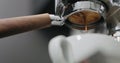 Pour espresso with bottomless portafilter low angle