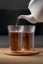 Pour hot tea into a glass clear