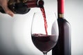 Pour red wine into glass Royalty Free Stock Photo