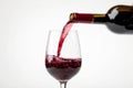 Pour red wine on white background. Generative ai Royalty Free Stock Photo
