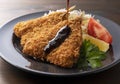 Pour the sauce on a plate of fried horse mackerel Royalty Free Stock Photo