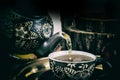 Pour tea from teapot in retro concept Royalty Free Stock Photo