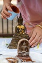 Pour water on Buddha statue the Thai traditions on Songkran Day