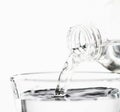 Pour water from plastic bottles to glass Royalty Free Stock Photo