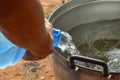 Pour water into the pot, boiling water, making soup.blurred photo Royalty Free Stock Photo