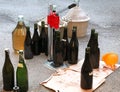 Pour the wine in the backyard with the Carboy and glass bottles Royalty Free Stock Photo
