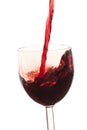 Pour the wine into the glass on a white background