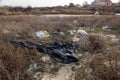 Poured garbage on Sea coast is left by tourists and vacationers. Dirty sea sandy shore of Sea. Environmental pollution.