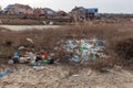 Poured garbage on Sea coast is left by tourists and vacationers. Dirty sea sandy shore of Sea. Environmental pollution. Environme