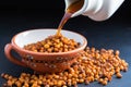 poured out roasted chickpeas from ceramic pitcher