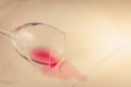 poured wine glass on marble background/ poured red wine glass on marble background. Top view and copyspace