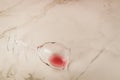 Poured wine glass on marble background/poured red wine glass on marble background. Copyspae