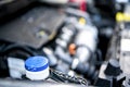 Pouring antifreeze. Filling a windshield washer tank with an antifreeze in winter cold weather. Royalty Free Stock Photo