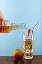 pouring apple juice in to a glass