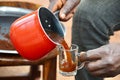 Pouring Arabica Coffee into a Mug