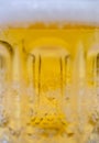 Pouring beer from bubble foam in glass for background on front view wave shape foam texture, drinking alcohol holiday