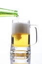 Pouring beer glass to drink beer on white background Royalty Free Stock Photo