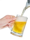 Pouring beer into mug isolated Royalty Free Stock Photo