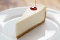 Pouring berry jam on slice of traditional new york cheesecake on white plate on wood table