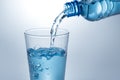 Pouring water from bottle into glass Royalty Free Stock Photo