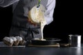 Pouring cake dough into baking tin. man hold bowl and pouring batter