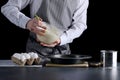 Pouring cake dough into baking tin. man hold bowl and pouring batter