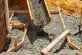 Pouring cement during sidewalk upgrade Royalty Free Stock Photo