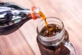 Pouring coca cola sparkling water into a glass Royalty Free Stock Photo