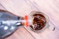 Pouring coca cola sparkling water into a glass Royalty Free Stock Photo
