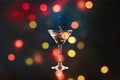 Pouring martini cocktail on blurred background Royalty Free Stock Photo