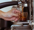 Pouring coffee into a cup of coffee Royalty Free Stock Photo