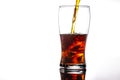 Pouring cola into glass with ice on white background Copy space Royalty Free Stock Photo