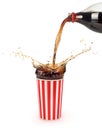 Pouring cola into paper cup with ice cubes, Royalty Free Stock Photo