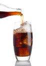 Pouring cola soda drink into the glass with ice Royalty Free Stock Photo