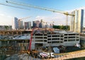 Pouring concrete from cement mixer. Tower crane on formwork at construction site. Reinforced concreting. Falsework, Ã¢â¬â¹Frames and