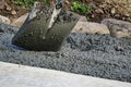 Pouring of concrete for a driveway. shovel Royalty Free Stock Photo