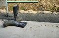 Pouring of concrete for a driveway view of gumboots Royalty Free Stock Photo