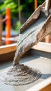 Pouring concrete into a mold with precision and focus for a construction project in an industrial setting Royalty Free Stock Photo